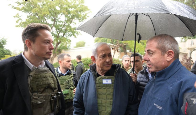 KRAR AZA, ISRAEL - NOVEMBER 27: In this handout image provided by the GPO, Israel's Prime Minister Benjamin Netanyahu (C) takes Elon Musk (L) on a tour of Kibbutz Kfar Aza after the October 7th Massacre took place there, on November 27, 2023 in Kfar Aza, Israel. Billionaire and boss of the social network X, Elon Musk, travelled to Israel during the truce between Israel and Hamas. Musk is due to speak with Israeli President Isaac Herzog about the online fight against anti-Semitism. (Photo by Amos Ben-Gershom (GPO) Handout via Getty Images)