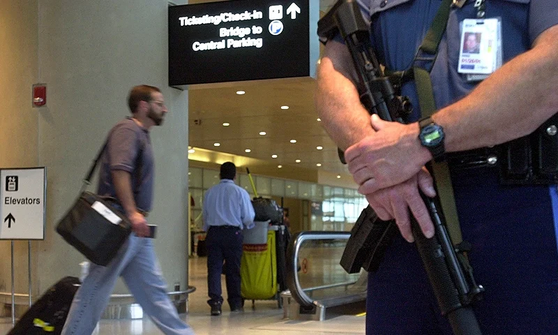 BOSTON, MA - JUNE 13: Massachusetts State Police Sergeant Steven Hines patrols with an MP-5 HNK submachine gun at Logan Airport June 13, 2003 in Boston, Massachusetts. The State Police antiterrorism unit started carrying the high-tech submachine guns, designed for close quarters, at the airport yesterday, making it the first U.S. airport to bring such advanced weaponry to its public areas. (Photo by William B. Plowman/Getty Images)