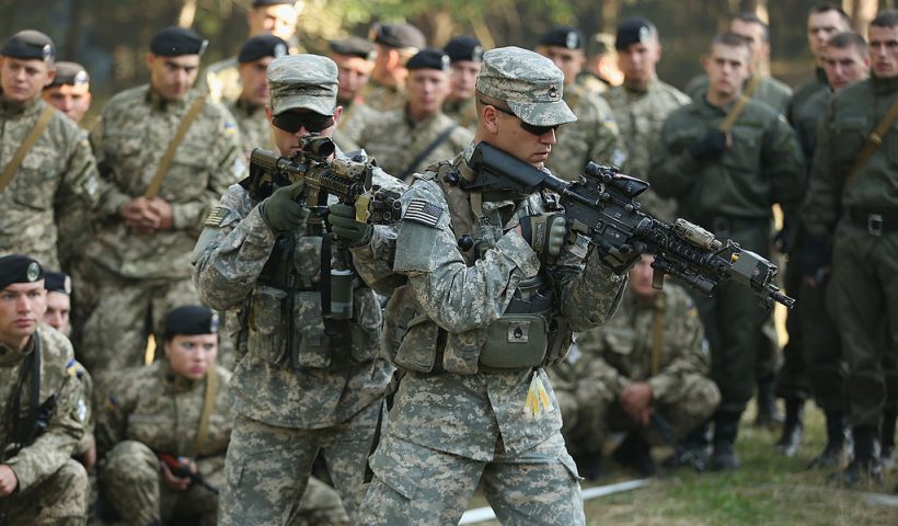 YAVOROV, UKRAINE - SEPTEMBER 16: Members of the U.S. Army 173rd Airborne Brigade demonstrate urban warfare techniques as Ukrainian soldiers look on on the second day of the 'Rapid Trident' bilateral military exercises between the United States and Ukraine that include troops from a variety of NATO and non-NATO countries on September 16, 2014 near Yavorov, Ukraine. The two-week exercises include participating units from a variety of NATO and NATO-associate countries as well as Ukrainian troops. Meanwhile the Ukrainian parliement today ratified an associate agreement with the European Union and also agreed on a autonomous status for the separatist-controlled portion of eatern Ukraine. (Photo by Sean Gallup/Getty Images)
