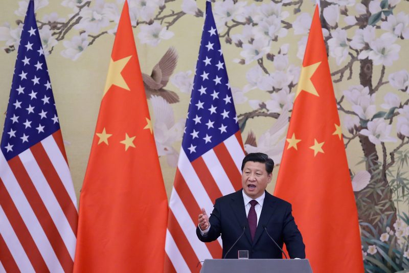 BEIJING, CHINA - NOVEMBER 12: Chinese President Xi Jinping (R) answers media's question during a press conference with U.S. President Barack Obama at the Great Hall of People on November 12, 2014 in Beijing, China. U.S. President Barack Obama pays a state visit to China after attending the 22nd Asia-Pacific Economic Cooperation (APEC) Economic Leaders' Meeting. (Photo by Feng Li/Getty Images)