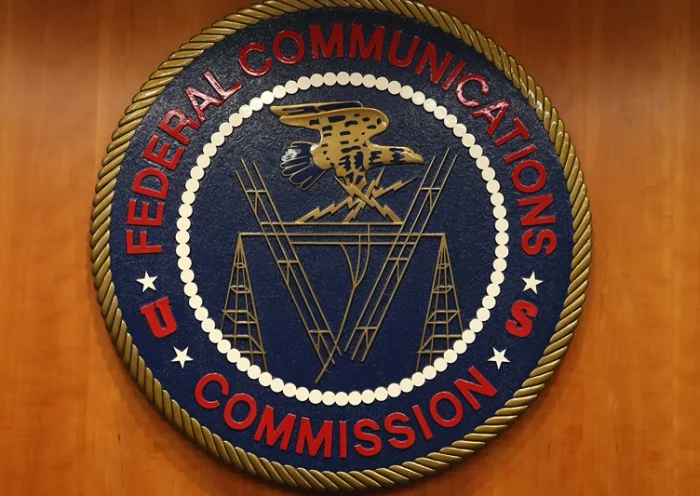 WASHINGTON, DC - FEBRUARY 26: The seal of the Federal Communications Commission hangs inside the hearing room at the FCC headquarters February 26, 2015 in Washington, DC. (Photo by Mark Wilson/Getty Images)