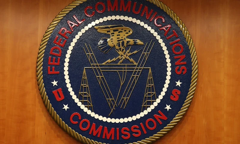 WASHINGTON, DC - FEBRUARY 26: The seal of the Federal Communications Commission hangs inside the hearing room at the FCC headquarters February 26, 2015 in Washington, DC. The Commission will vote on Internet rules, grounded in multiple sources of the Commissions legal authority, to ensure that Americans reap the benefits of an open Internet. (Photo by Mark Wilson/Getty Images)