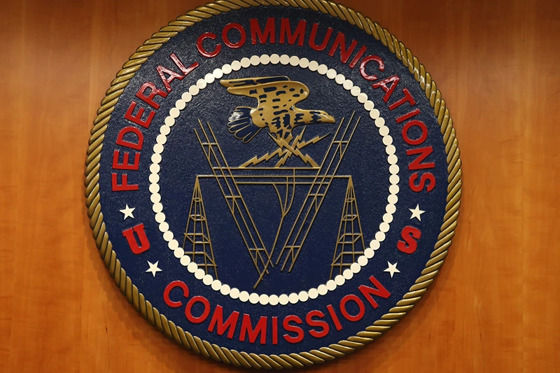 WASHINGTON, DC - FEBRUARY 26: The seal of the Federal Communications Commission hangs inside the hearing room at the FCC headquarters February 26, 2015 in Washington, DC. The Commission will vote on Internet rules, grounded in multiple sources of the Commissions legal authority, to ensure that Americans reap the benefits of an open Internet. (Photo by Mark Wilson/Getty Images)