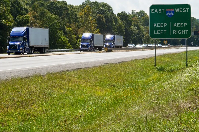 The US Federal Highway Administration conducts demonstrations of partially automated semi-truck platoons September 14, 2017, as three specially equiped Volvo semi-trucks cruise in Centreville, Virginia, with a Virginia State Trooper escort.