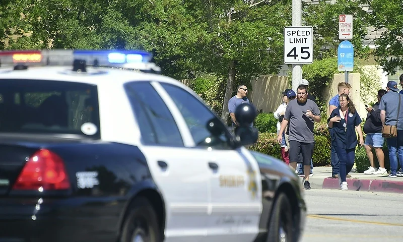 Police man an intersection May 11, 2018 following reports of shooting at Highland High School in Palmdale, 40 miles (65 kilometers) north of downtown Los Angeles. - Police arrested a man after reports of shootings at two schools near Los Angeles, the local sheriff's department and education officials said. The Los Angeles County Sheriff said one suspect had been detained "regarding the person with a gun" at Highland High School. Local news reports had earlier said that at least one person had been wounded. It was not immediately clear what type of weapon the man had. (Photo by Frederic J. BROWN / AFP) (Photo credit should read FREDERIC J. BROWN/AFP via Getty Images)