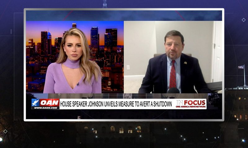Video still from In Focus on One America News Network showing a split screen of the host on the left side, and on the right side is the guest, Ed Martin.