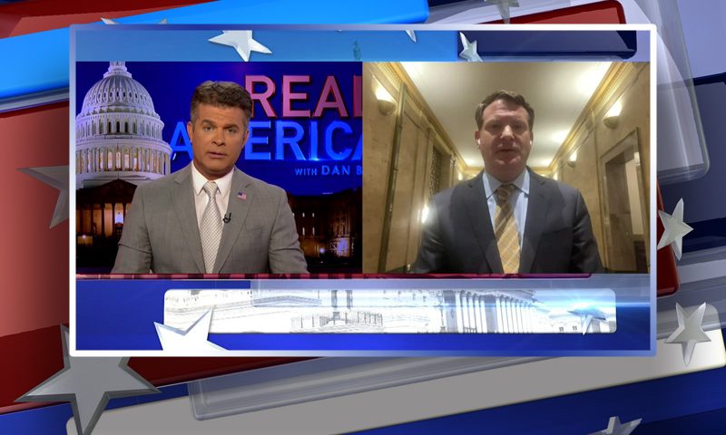 Video still from Real America on One America News Network showing a split screen of the host on the left side, and on the right side is the guest, Mike Davis.