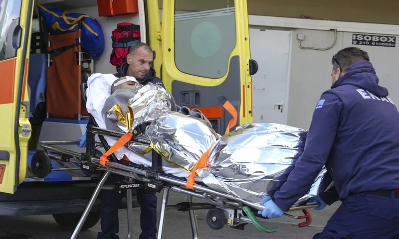 3 of 3 | Paramedics transfer a survivor of a shipwreck at a hospital, on the northeastern Aegean Sea island of Lesbos, Greece, Sunday, Nov. 26, 2023. A cargo ship sank off the Greek island of Lesbos early Sunday, leaving 13 crew members missing and one rescued, authorities said. The Raptor, registered in the Comoros, was on its way to Istanbul from Alexandria, Egypt, carrying 6,000 tons of salt, the coast guard said. It had a crew of 14, including eight Egyptians, four Indians and two Syrians, the coast guard said. (AP Photo/Panagiotis Balaskas)