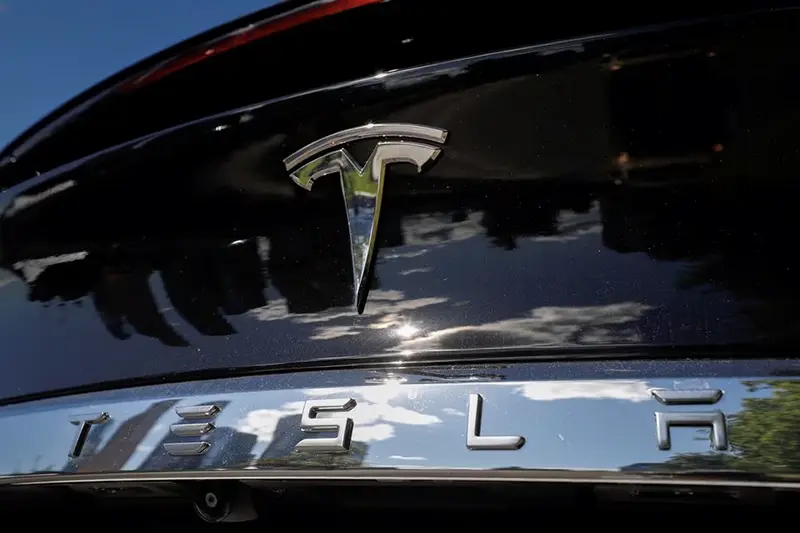 The company logo is pictured on a Tesla Model X electric vehicle in this picture illustration taken in Moscow, Russia July 23, 2020. Picture taken July 23, 2020. REUTERS/Evgenia Novozhenina/File Photo