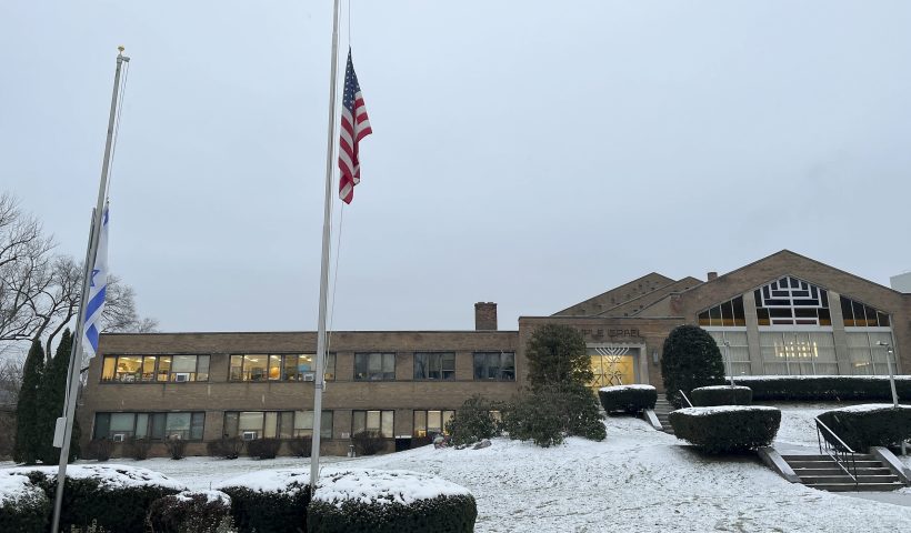 A menorah stands outside the entrance to Temple Israel, Thursday, Dec. 7, 2023, in Albany, N.Y. A 28-year-old suspect was in police custody for allegedly firing two rounds from a shotgun outside the Jewish temple on Friday, just hours before the start of Hanukkah. Officials said no one was injured and police they did not know the man's motive.(AP Photo/Maysoon Khan)