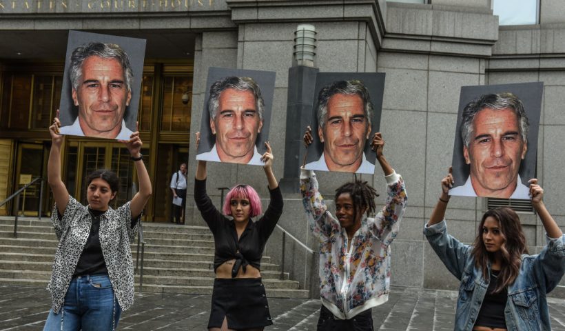 NEW YORK, NY - JULY 08: A protest group called "Hot Mess" hold up signs of Jeffrey Epstein in front of the Federal courthouse on July 8, 2019 in New York City. According to reports, Epstein will be charged with one count of sex trafficking of minors and one count of conspiracy to engage in sex trafficking of minors. (Photo by Stephanie Keith/Getty Images)