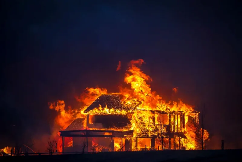 LOUISVILLE, CO - DECEMBER 30: A home burns after a fast moving wildfire swept through the area in the Centennial Heights neighborhood of Louisville, Colorado on December 30, 2021. State officials estimated some 600 homes had already been lost in multiple areas around Boulder County and were fueled by winds that gusted upwards of 100 miles per hour at times during the day. (Photo by Marc Piscotty/Getty Images)