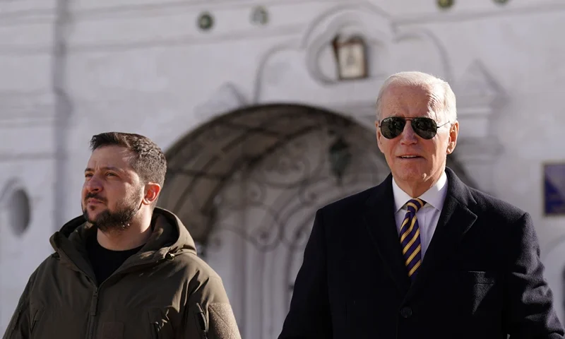 US President Joe Biden (R) walks next to Ukrainian President Volodymyr Zelensky (L) as he arrives for a visit in Kyiv on February 20, 2023. - US President Joe Biden made a surprise trip to Kyiv on February 20, 2023, ahead of the first anniversary of Russia's invasion of Ukraine, AFP journalists saw. Biden met Ukrainian President Volodymyr Zelensky in the Ukrainian capital on his first visit to the country since the start of the conflict. (Photo by Dimitar DILKOFF / AFP) (Photo by DIMITAR DILKOFF/AFP via Getty Images)