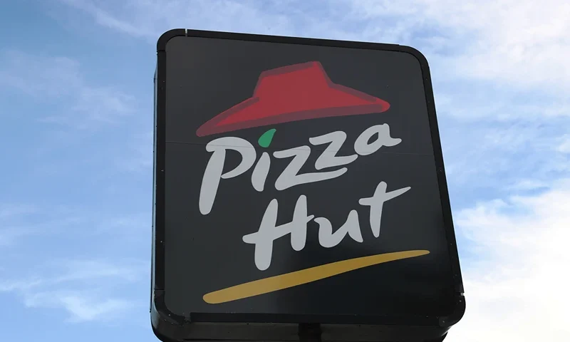 MIAMI, FLORIDA - AUGUST 17: A sign is seen at a Pizza Hut restaurant on August 17, 2020 in Miami, Florida. NPC International announced it had reached an agreement with Yum! Brands, the parent company of Pizza Hut, to close approximately 300 Pizza Hut locations after it filed for bankruptcy. (Photo by Joe Raedle/Getty Images)