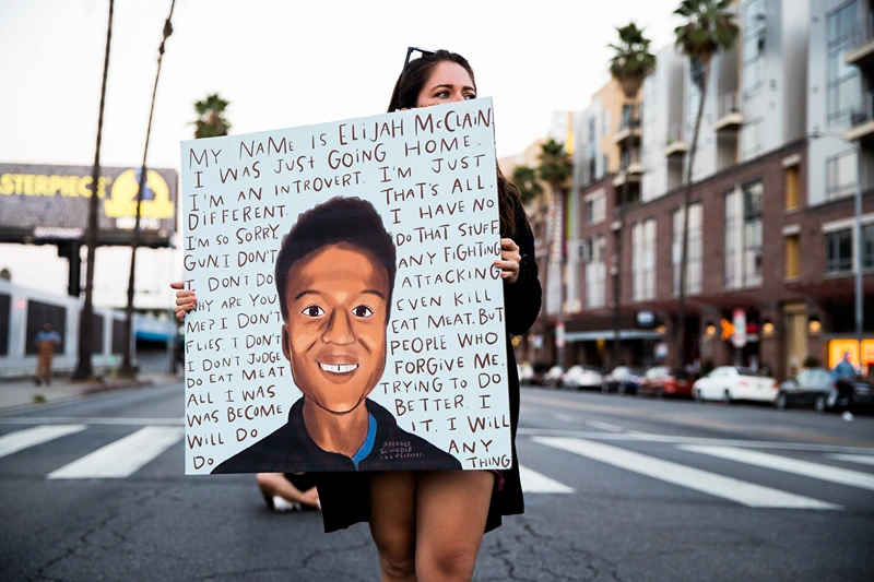 Laugh Factory Hosts Candlelight Vigil To Demand Justice For Elijah McClain
WEST HOLLYWOOD, CALIFORNIA - AUGUST 24: A person holds a sign at a candlelight vigil to demand justice for Elijah McClain on the one year anniversary of his death at The Laugh Factory on August 24, 2020 in West Hollywood, California. (Photo by Rich Fury/Getty Images)