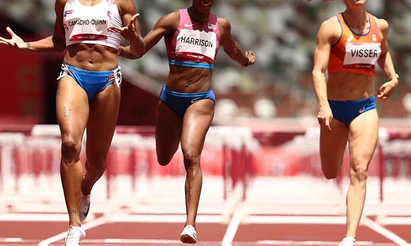TOKYO, JAPAN - AUGUST 02: Jasmine Camacho-Quinn of Team Puerto Rico celebrates as she finishes first ahead of Kendra Harrison of Team United States in the Women's 100m Hurdles Final on day ten of the Tokyo 2020 Olympic Games at Olympic Stadium on August 02, 2021 in Tokyo, Japan. (Photo by Ryan Pierse/Getty Images)