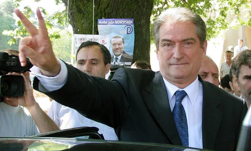 TOPSHOT-ALBANIA-ELECTIONS-BERISHA-VOTE TOPSHOT - Former Albanian President and leader of the opposition Democratic Party, Sali Berisha, make the sing of victory after casting his ballot in the legislative elections, in Tirana, 03 July 2005. Albanians began voting on Sunday in legislative elections seen as crucial to their country's ambition to join the European Union but overshadowed by fears that whatever the result it will be rejected by the loser and even lead to violence. AFP PHOTO / GENT SHKULLAKU (Photo by GENT SHKULLAKU / AFP) (Photo by GENT SHKULLAKU/AFP via Getty Images)