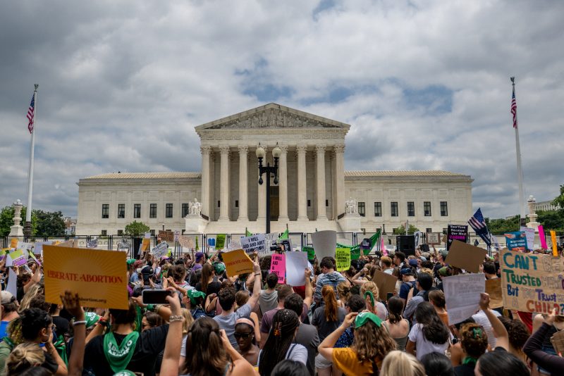 WASHINGTON, DC - JUNE 24: People protest in response to the Dobbs v Jackson Women's Health Organization ruling in front of the U.S. Supreme Court on June 24, 2022 in Washington, DC. The Court's decision in Dobbs v Jackson Women's Health overturns the landmark 50-year-old Roe v Wade case and erases a federal right to an abortion. (Photo by Brandon Bell/Getty Images)