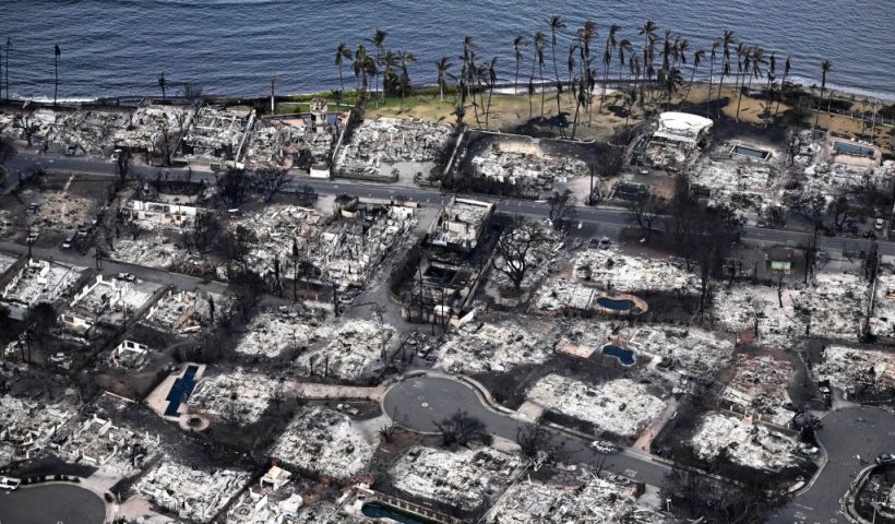 An aerial image taken on August 10, 2023 shows destroyed homes and buildings burned to the ground in Lahaina in the aftermath of wildfires in western Maui, Hawaii. At least 36 people have died after a fast-moving wildfire turned Lahaina to ashes, officials said August 9, 2023 as visitors asked to leave the island of Maui found themselves stranded at the airport. The fires began burning early August 8, scorching thousands of acres and putting homes, businesses and 35,000 lives at risk on Maui, the Hawaii Emergency Management Agency said in a statement. (Photo by Patrick T. Fallon / AFP) (Photo by PATRICK T. FALLON/AFP via Getty Images)