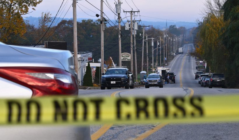 Police tape blocks off the street near Schemengees Bar and Grille in Lewiston, Maine, on October 27, 2023, in the aftermath of a mass shooting. Hundreds of police in the US state of Maine hunted October 26, 2023 for a fugitive gunman who killed 18 people at a bowling alley and a bar, as President Joe Biden mourned "yet another senseless and tragic mass shooting." Police named the suspect as 40-year-old Robert Card -- seen in surveillance footage pointing a semi-automatic rifle as he walked into the Sparetime Recreation bowling alley. (Photo by ANGELA WEISS / AFP) (Photo by ANGELA WEISS/AFP via Getty Images)