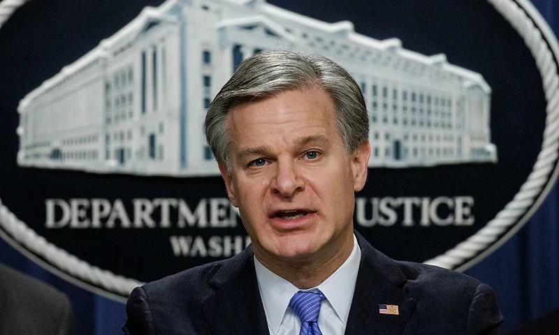 WASHINGTON, DC - DECEMBER 6: FBI Director Christopher Wray speaks during a press conference at the U.S. Department of Justice on December 6, 2023 in Washington, DC. The Department of Justice announced today that four Russian military personnel have been indicted for war crimes committed against a U.S. national living in Ukraine, the first of such charges ever to be brought under the U.S. war crimes statute. (Photo by Samuel Corum/Getty Images)