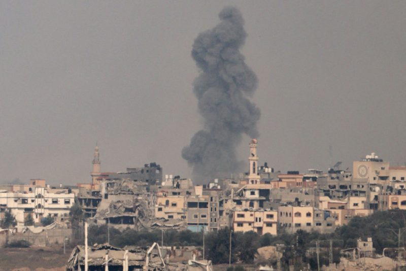 A picture taken in southern Israel near the border with the Gaza Strip on December 7, 2023, shows smoke billowing during Israeli bombardment on Gaza, amid continuing battles between Israel and the militant group Hamas. (Photo by Menahem KAHANA / AFP) (Photo by MENAHEM KAHANA/AFP via Getty Images)