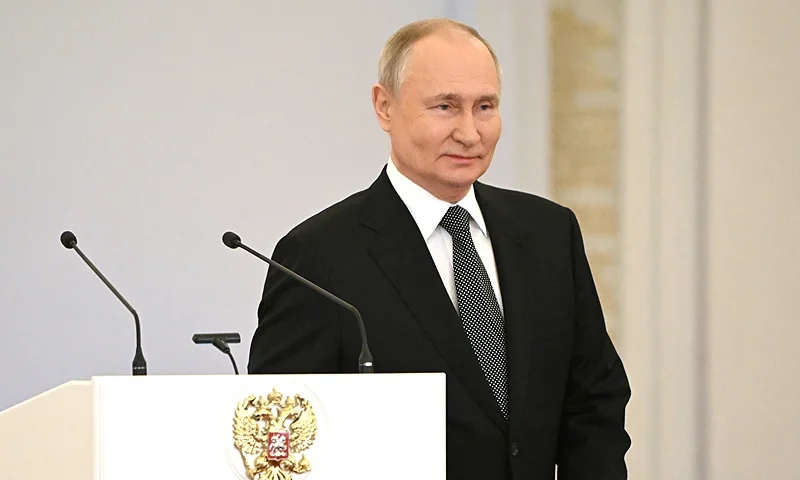 This pool photograph distributed by Russian state agency Sputnik shows Russia's President Vladimir Putin attending a ceremony to present Gold Star medals to Heroes of Russia on the eve of the Heroes of the Fatherland Day at the St. George Hall of the Grand Kremlin Palace in Moscow on December 8, 2023. Russian leader Vladimir Putin has decided to run in presidential elections next March, news agencies reported on December 8, 2023, allowing the Kremlin leader to extend his decades-long grip on power. Putin told Lieutenant Colonel Artyom Zhoga, a Russian military officer, about his decision to participate in the upcoming vote following an awards ceremony for army personnel at the Kremlin, state-run news agencies reported. (Photo by Sergey GUNEYEV / POOL / AFP) (Photo by SERGEY GUNEYEV/POOL/AFP via Getty Images)