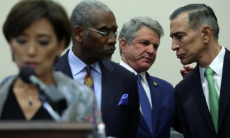 WASHINGTON, DC - DECEMBER 05: Chairman of U.S. House Foreign Affairs Committee Rep. Michael McCaul (R-TX) (2nd R) talks to Rep. Darrell Issa (R-CA) (R) as ranking member Rep. Gregory Meeks (D-NY) (3rd R) listens during a news conference on the Israel-Hamas war at Rayburn House Office Building on Capitol Hill on December 5, 2023 in Washington, DC. Rep. McCaul and ranking member Rep. Gregory Meeks (D-NY) held a press conference with the American Jewish Committee (AJC) and several family members of individuals held hostage by Hamas “to highlight the approaching two months mark since their family members were kidnapped.” (Photo by Alex Wong/Getty Images)