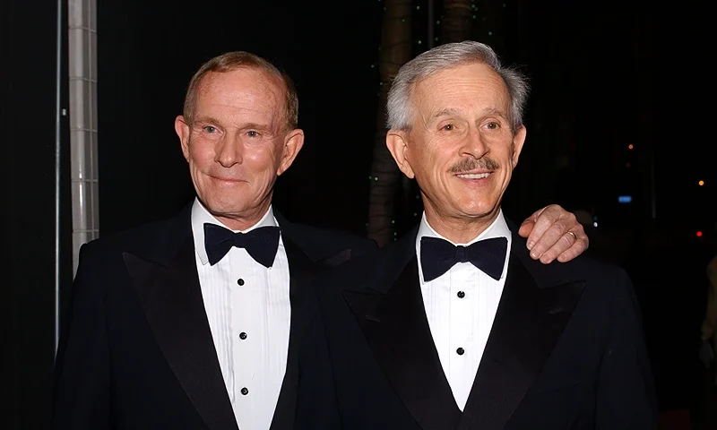 LOS ANGELES - JUNE 3: Comedians Tom and Dick Smothers ("The Smothers Brothers") pose before their show at the Comedy Store on June 3, 2003 in Los Angeles, California. (Photo by Amanda Edwards/Getty Images)
