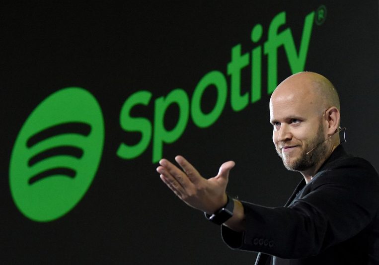 Daniel Ek, CEO of Swedish music streaming service Spotify, gestures as he makes a speech at a press conference in Tokyo on September 29, 2016.