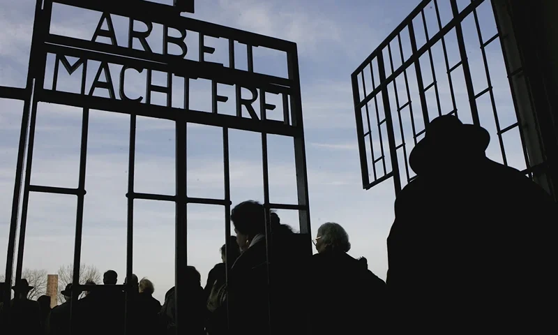 ORANIENBURG - DECEMBER 15: Roma, (also known as Gypsy) survivors of the Holocaust enter the former concentration camp at Sachsenhausen on December 15, 2006 in Oranienburg, Germany. Approximately a dozen survivors, along with representatives of the Central Council of Sinti and Roma in Germany, commemorated the 64th anniversary of the "Auschwitz Decree" of December 14, 1943, in which Heinrich Himmler ordered the deportation of Germany's remaining Roma to Auschwitz. An estimated 500,000 Roma died at the hands of the Nazis during World War II. (Photo by Sean Gallup/Getty Images)