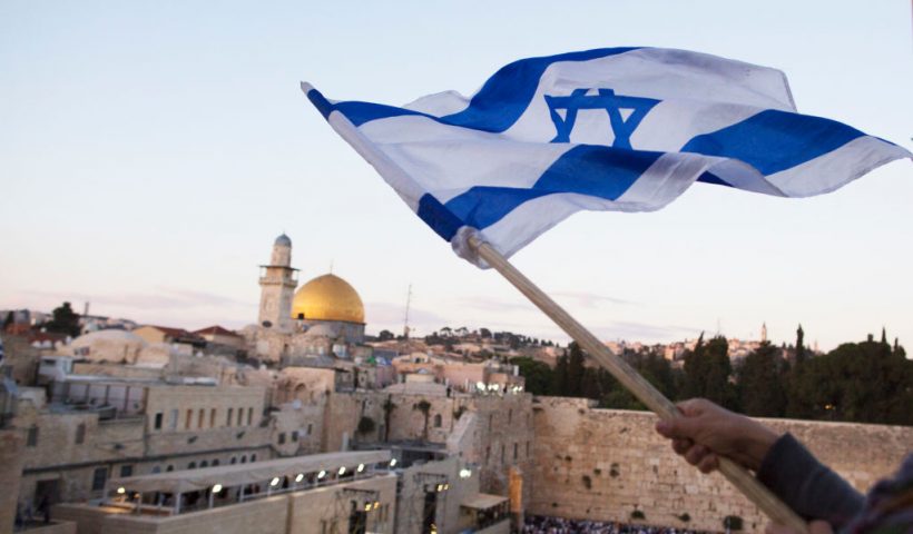 JERUSALEM, ISRAEL - MAY 13: (ISRAEL OUT) Israelis wave their national flags during a march next to the Western Wall on May 13, 2018 in Jerusalem, Israel. Israel mark Jerusalem Day celebrations the 51th anniversary of its capture of Arab east Jerusalem in the Six Day War of 1967. One day before US will move the Embassy to Jerusalem. (Photo by Lior Mizrahi/Getty Images)