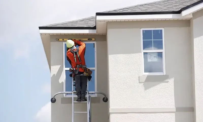 A carpenter works on new townhomes that are still under construction while building material supplies are in high demand in Tampa, Florida, U.S., May 5, 2021. REUTERS/Octavio Jones/File Photo