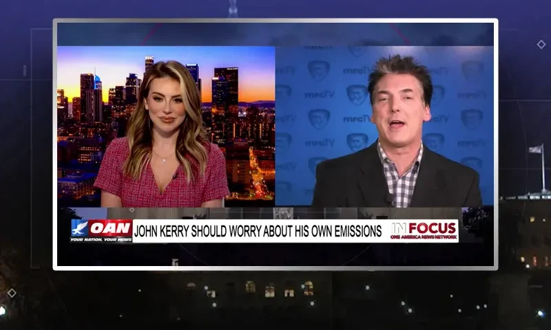 Video still from In Focus on One America News Network showing a split screen of the host on the left side, and on the right side is the guest, Eric Scheiner.