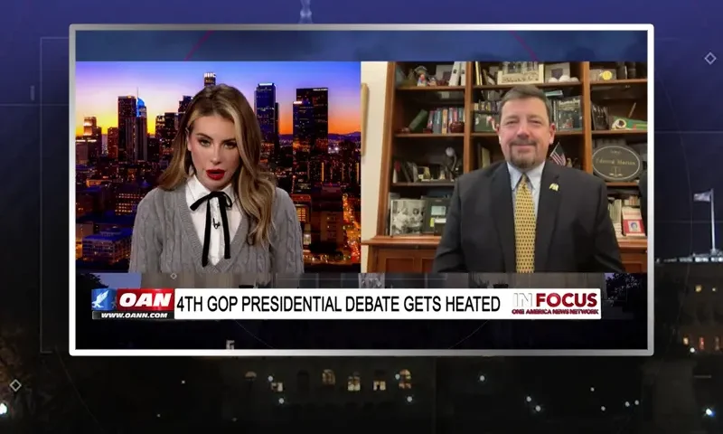 Video still from In Focus on One America News Network showing a split screen of the host on the left side, and on the right side is the guest, Ed Martin.