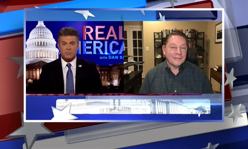 Video still from Real America on One America News Network showing a split screen of the host on the left side, and on the right side is the guest, Steve Milloy.