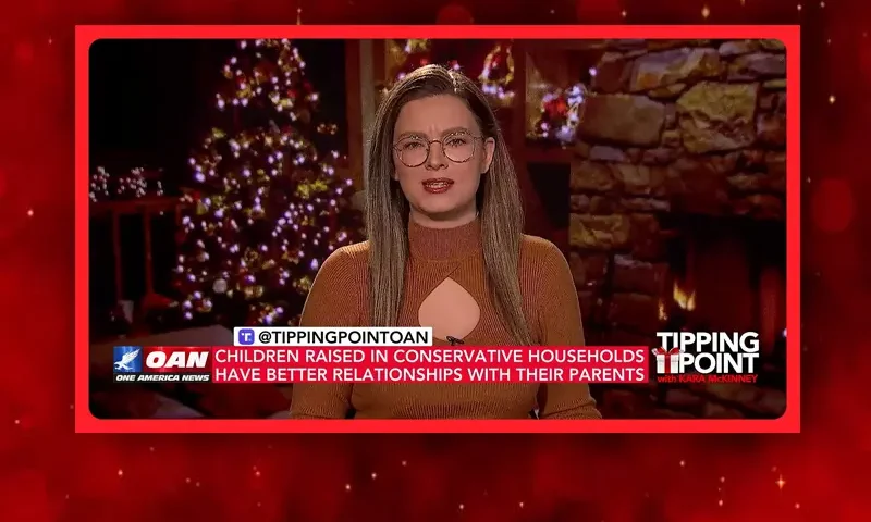 Video still of the host of Tipping Point at the desk of their talk show on One America News Network.