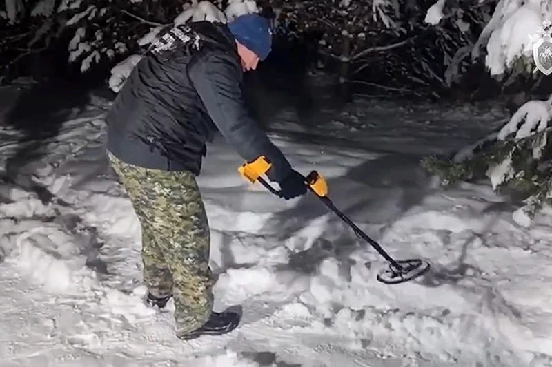 of 2 | In this photo taken from video released by Russian Investigative Committee on Wednesday, Dec. 6, 2023, investigators work at the place where Illia Kyva was killed in a cottage village near Moscow, Russia. Kyva, a former member of Ukraine's parliament who had called for Kyiv to surrender when Russian troops invaded the country in February 2022, was found on Wednesday with a gunshot wound to the head in a cottage village near Moscow. (Russian Investigative Committee via AP)