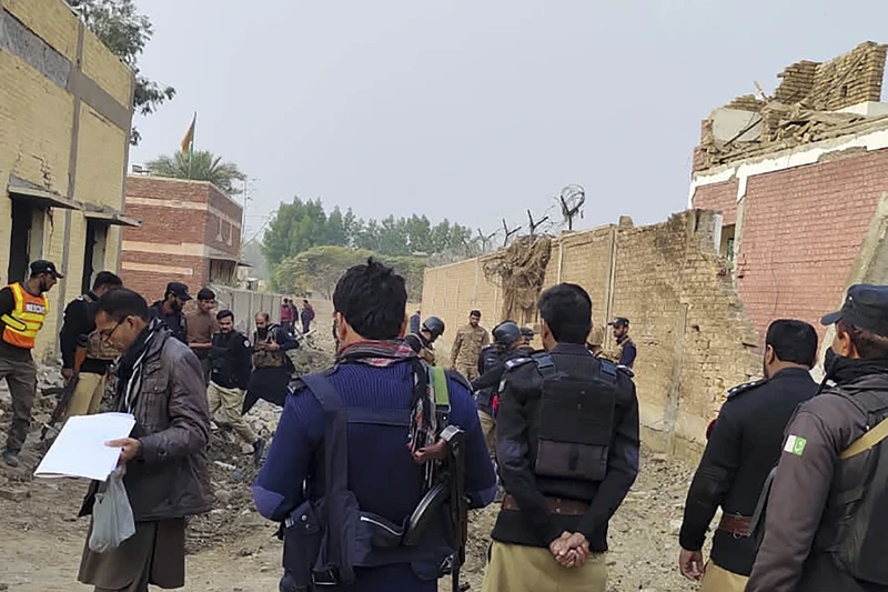 of 3
Security officials examine damages on the site of a bombing at a police station on the outskirts of Dera Ismail Khan, Pakistan, Tuesday, Dec. 12, 2023. A suicide bomber detonated his explosive-laden vehicle at a police station's main gate in northwest Pakistan on Tuesday, killing several policemen and wounding more than dozen others, officials said. Some militants also opened fire and a shootout between them and security forces was still ongoing, police officer Kamal Khan said. (AP Photo)