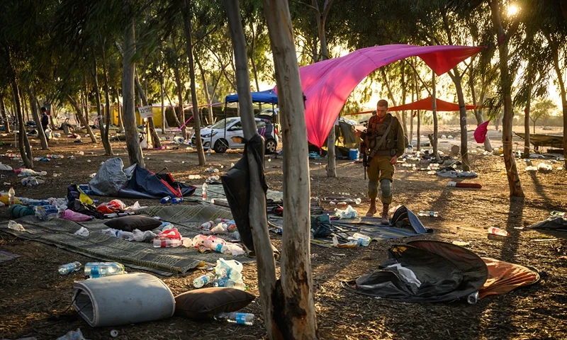 RE'IM, ISRAEL - OCTOBER 12: Members of the security forces continue to search for identification and personal effects at the Supernova Music Festival site, where hundreds were killed and dozens taken by Hamas militants near the border with Gaza, on October 12, 2023 in Kibbutz Re'im, Israel. Israel has sealed off Gaza and launched sustained retaliatory air strikes, which have killed at least 1,200 people with more than 300, 000 displaced, after a large-scale attack by Hamas. On October 7, the Palestinian militant group Hamas launched a surprise attack on Israel from Gaza by land, sea, and air, killing over 1,200 people and wounding around 2800. Israeli soldiers and civilians have also been taken hostage by Hamas and moved into Gaza. The attack prompted a declaration of war by Israeli Prime Minister Benjamin Netanyahu and the announcement of an emergency wartime government. (Photo by Leon Neal/Getty Images)