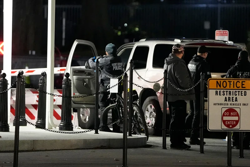 US Secret Service police investigate near a vehicle that hit a security barrier at a entry point for the White House complex, January 8, 2024, in Washington. (Photo via; Mark Schiefelbein/AP)