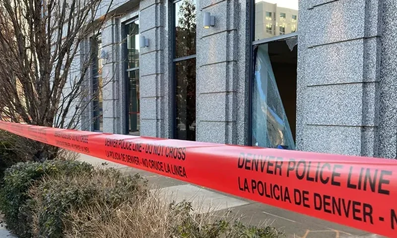 Police tape in front of damaged windows at the Colorado Supreme Court on Tuesday, Jan. 2, 2024 in Denver. Authorities say a man inflicted "extensive damage" to the building. (AP Photo/Colleen Slevin)