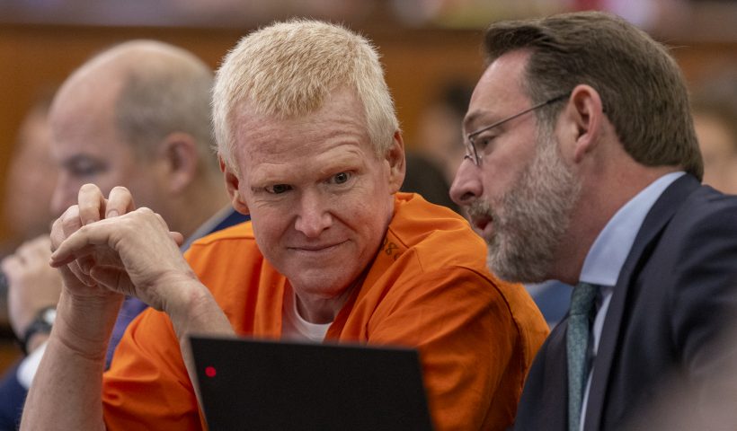 Alex Murdaugh, left, confers with Phil Barber during a judicial hearing at the Richland County Judicial Center in Columbia, S.C., Monday, Jan. 29, 2024. (Tracy Glantz/The State via AP, Pool)