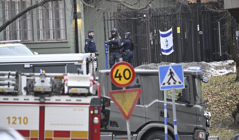 Officers stand near the Israeli Embassy in Stockholm, Sweden, Wednesday, Jan. 31, 2024. An object said to be “sharp” was found outside the Israeli Embassy in Stockholm on Wednesday, and was eventually destroyed. Dozens of officers were dispatched to the scene and sealed off the area before a bomb squad arrived. (Henrik Montgomery/TT News Agency via AP)