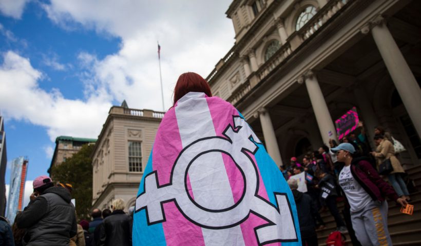 NEW YORK, NY - OCTOBER 24: L.G.B.T. activists and their supporters rally in support of transgender people on the steps of New York City Hall, October 24, 2018 in New York City. The group gathered to speak out against the Trump administration's stance toward transgender people. Last week, The New York Times reported on an unreleased administration memo that proposes a strict biological definition of gender based on a person's genitalia at birth. (Photo by Drew Angerer/Getty Images)
