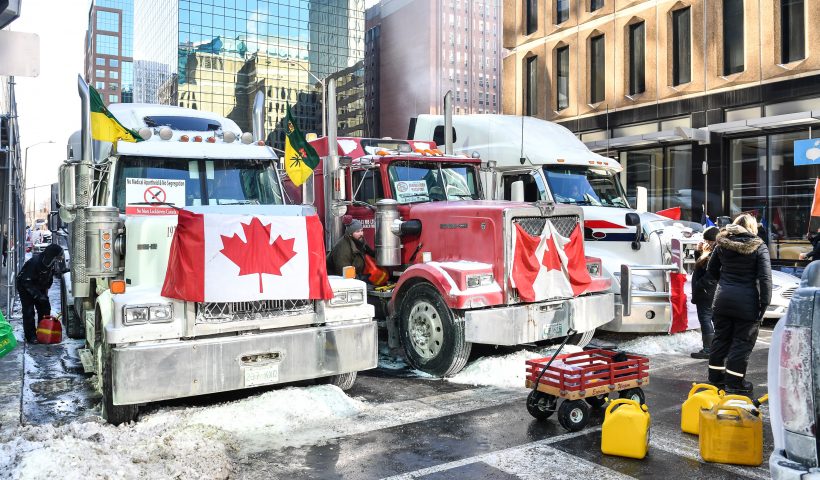 OTTAWA, ON - FEBRUARY 05: Truckers refuel their trucks in the cold during the Freedom Convoy truck protest on February 5, 2022 in Ottawa, Canada. Truckers continue their rally over the weekend near Parliament Hill in hopes of pressuring the government to roll back COVID-19 public health regulations and mandates. (Photo by Minas Panagiotakis/Getty Images)