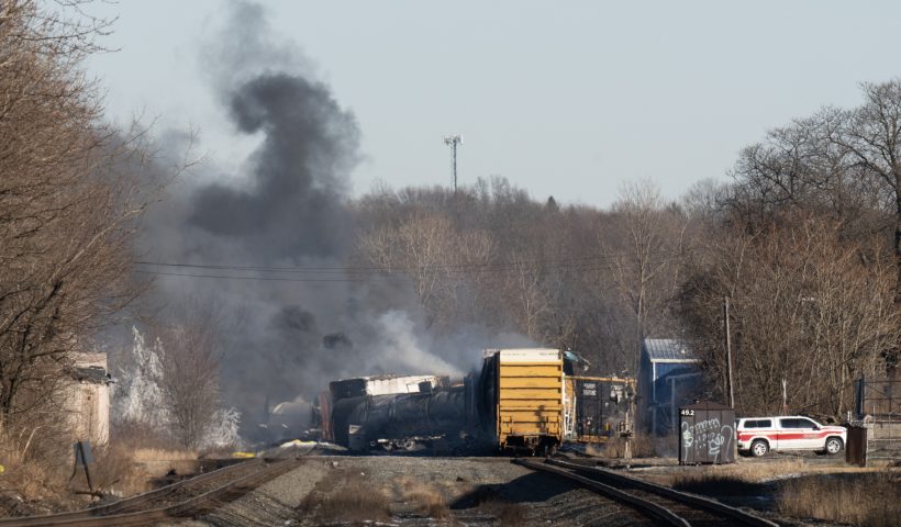 Smoke rises from a derailed cargo train in East Palestine, Ohio, on February 4, 2023. - The train accident sparked a massive fire and evacuation orders, officials and reports said Saturday. No injuries or fatalities were reported after the 50-car train came off the tracks late February 3 near the Ohio-Pennsylvania state border. The train was shipping cargo from Madison, Illinois, to Conway, Pennsylvania, when it derailed in East Palestine, Ohio. (Photo by DUSTIN FRANZ / AFP) (Photo by DUSTIN FRANZ/AFP via Getty Images)