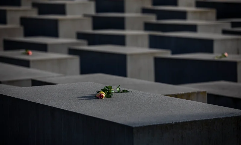 BERLIN, GERMANY - JANUARY 27: Roses are placed on the Holocaust Memorial on the International Holocaust Remembrance Day on January 27, 2021 in Berlin, Germany. Today marks the 76th anniversary of the liberation of the Auschwitz concentration camp by Soviet Forces in 1945, where Germany's Nazis were responsible for the deaths over one million Jews and other victims during World War II. (Photo by Maja Hitij/Getty Images)