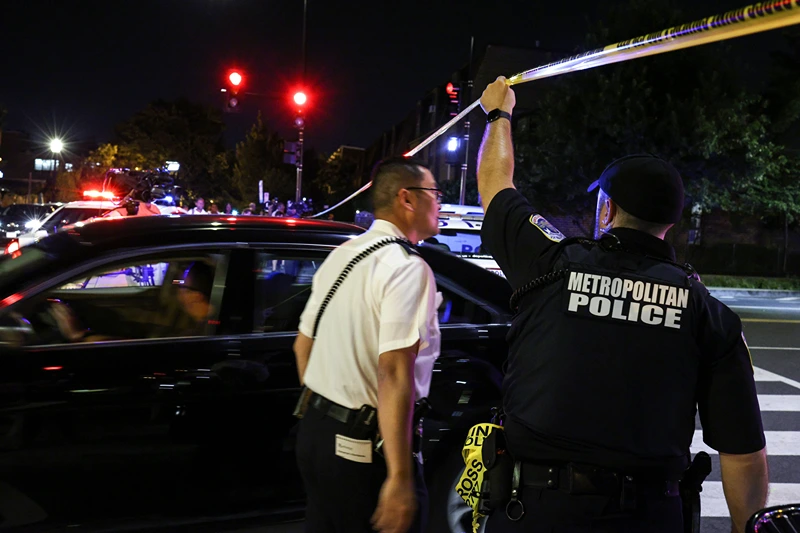 Multiple People Injured In Washington, DC Shooting
WASHINGTON, DC - JULY 22: A police officer holds up caution tape near the site of a shooting on July 22, 2021 in Washington, DC. Gunfire erupted on a busy street, injuring two and sending others fleeing for safety. A dark sedan was being sought in connection with the shooting and the two injured were expected to survive, according to published reports. (Photo by Anna Moneymaker/Getty Images)