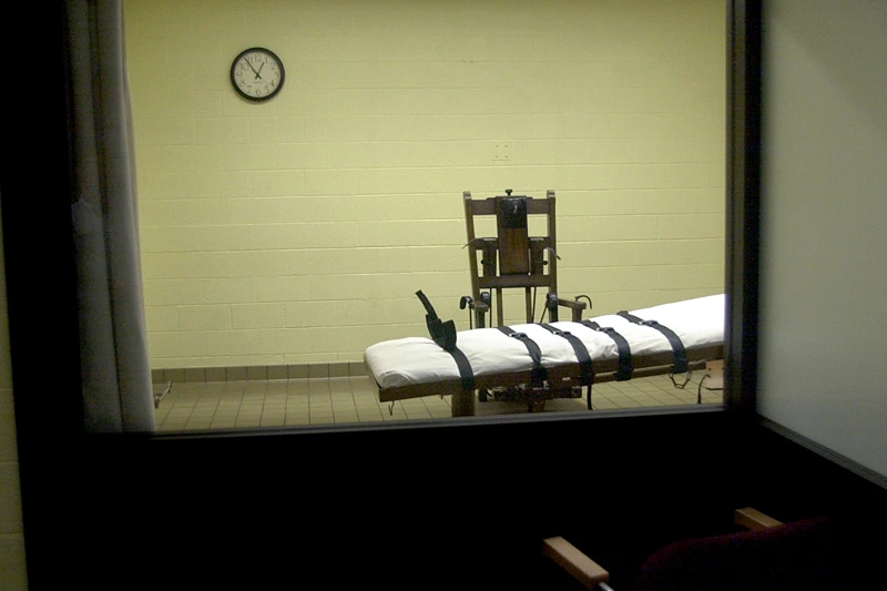 Death Chamber at Southern Ohio Correctional Facility
393846 05: A view of the death chamber from the witness room at the Southern Ohio Correctional Facility shows an electric chair and gurney August 29, 2001 in Lucasville, Ohio. The state of Ohio is one of the few states that still uses the electric chair, and it gives death row inmates a choice between death by the electric chair or by lethal injection. John W. Byrd, who will be executed on September 12, 2001, has stated that he will choose the electric chair. (Photo by Mike Simons/Getty Images)